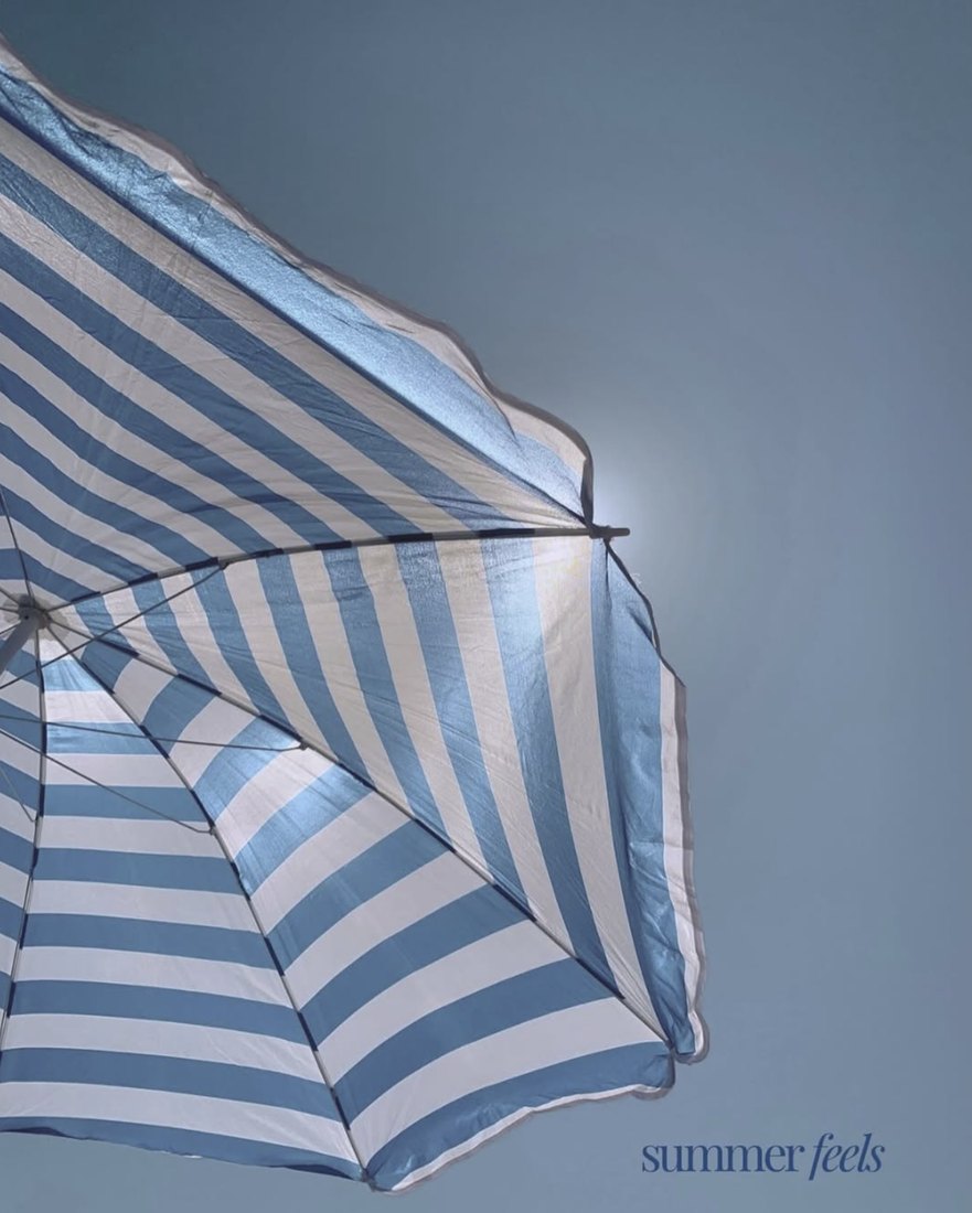 Blue and white striped umbrella